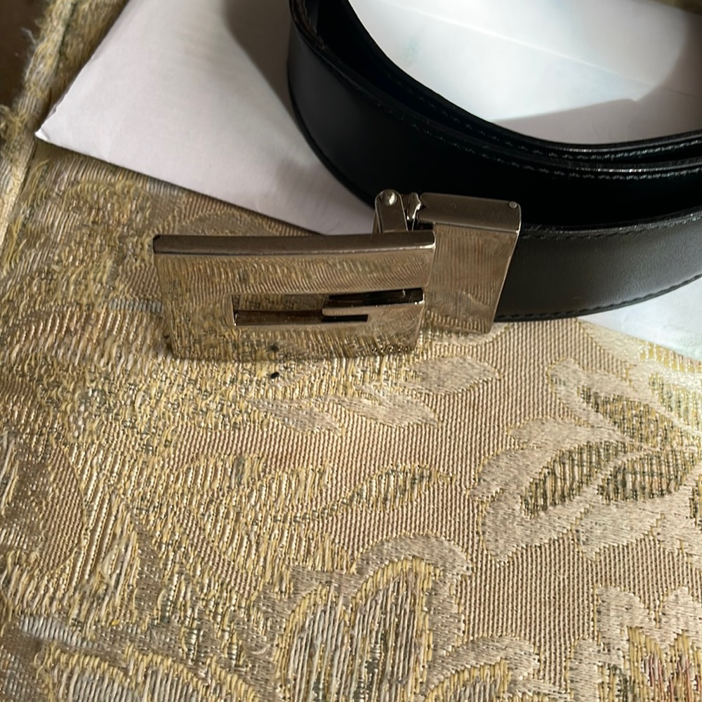 Gucci  leather belt. Black with a silver buckle